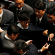 Security guards block pro-independence legislator-elect Baggio Leung from retaking his oath inside the Legislative Council in Hong Kong, Nov. 2, 2016.